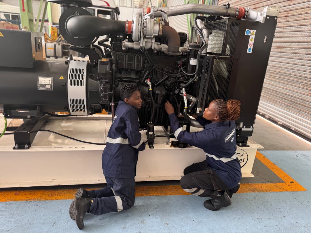 Powermec technicians servicing a generator in the workshop
